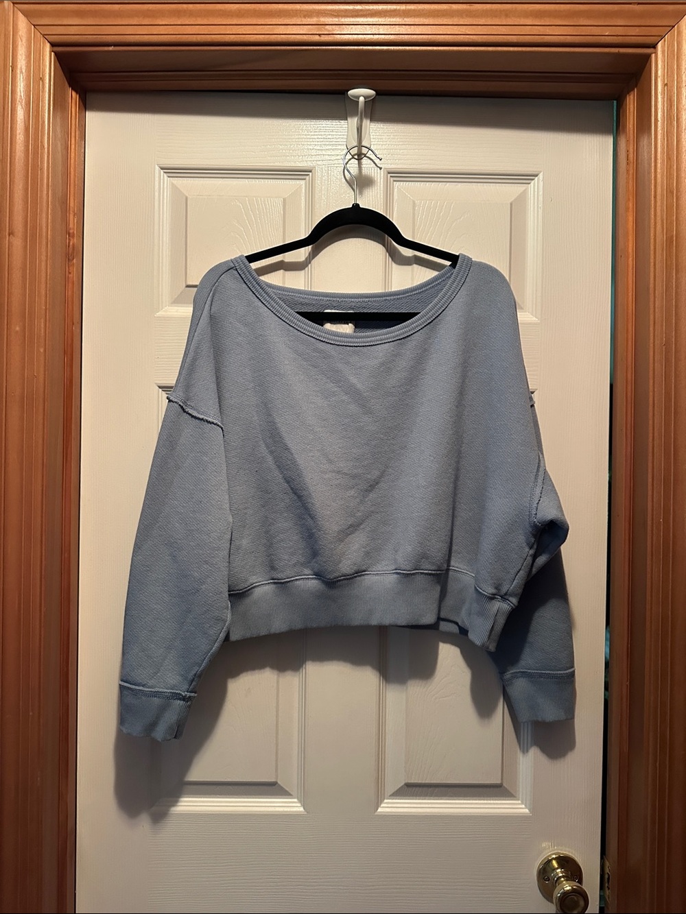 American Eagle Outfitters Off-the-Shoulder Cropped Sweatshirt in Light Blue